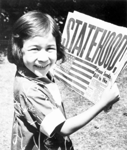 Statehood! A young girl (Dodie Bacon) with newspaper; Hawai‘i. 1959. Call Number: G. & P. State of Hawai‘i. Image from Bishop Museum Archives, Honolulu, Hawaii. Images are not to be re-used without permission.