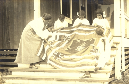 Girls making a quilt of Hawaiian Flag design, 1923. Call Number: Ethnic Culture. Hawaiian. Art. Quilting. Image from Bishop Museum Archives, Honolulu, Hawaii. Images are not to be re-used without permission.