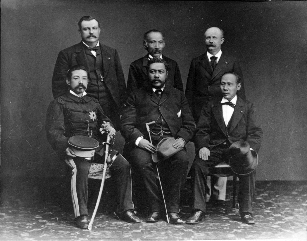 King Kalākaua during trip to Japan; (seated, lt.-rt.): Prince Yoshiaki, Kalākaua, Tsunetami Sano (Minister of Finance); (standing, lt.-rt.): Charles H. Judd, Ryosuke Tokuno (First Secretary of Finance), William N. Armstrong (Foreign Minister and Head of the Bureau of Immigration of Hawai‘i). 1881. Photographer: (original photo copied by) Norman Hill. Call Number: [SP 111657] People. Kalalakaua, 1874-1881, folder 2. Image from Bishop Museum Archives, Honolulu, Hawaii. Images are not to be re-used without permission.