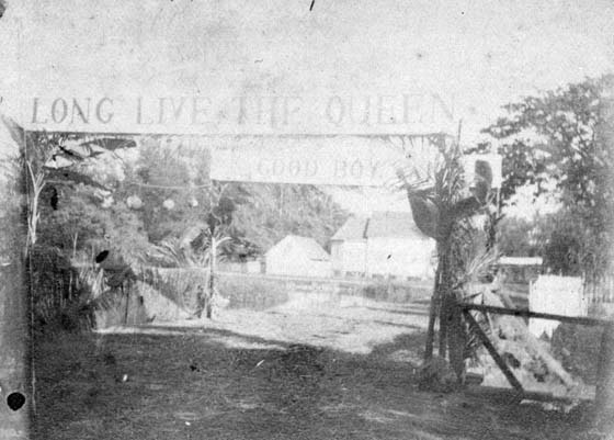 View of Lāhainā with banner in honor of Queen Lili‘uokalani; "LONG LIVE THE QUEEN" ca. 1891. Call Number: Government & Politics. Monarchy. Lili‘uokalani. Accession Number: 1976.330 Location: Bishop Museum Archives Image from Bishop Museum Archives, Honolulu, Hawaii. Images are not to be re-used without permission.