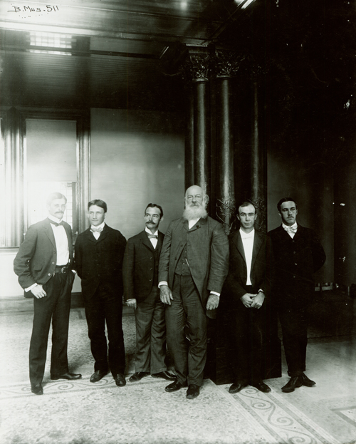 Group portrait in Bishop Museum's Hawaiian Hall, (from left to right) Allen Walcott, Alvine Seale, John J. Greene, W.T. Brigham, W.A. Bryan and J.F.G. Stokes; Honolulu, Hawai‘i. Unknown photographer, n.d. Call Number: SP 511 Image from Bishop Museum Archives, Honolulu, Hawaii. Images are not to be re-used without permission.