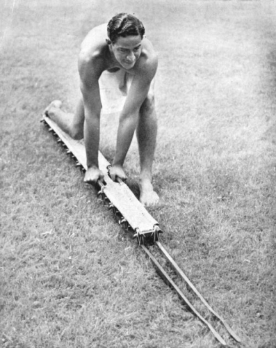 Man demonstrating the use of a Hawaiian Hōlua sled. Pan Pacific Press Photograph Collection: General Photograph Collection Call Number: E.C. Hawaiian. Recreation. Sledding. Location: Bishop Museum Archives Image from Bishop Museum Archives, Honolulu, Hawaii. Images are not to be re-used without permission.