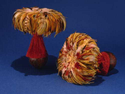 Pair of ‘ulī‘ulī (coconut dance rattles); Hawai‘i. These ‘ulī‘ulī were probablly exhibited by the Hawaiian government at the Paris Exposition Universelle, 1889. Coconut shell, chicken feathers, cotton and silk, leaf stems, wire, trade cordage, thread, ali‘ipoe. ca. 1885. Photo: ca. 1980 by Seth Joel. From: Roger Rose, Hawai‘i: The Royal Isles. (Honolulu: Bishop Museum Press, 1980), pg. 16, no. 153. Image from Bishop Museum Archives, Honolulu, Hawaii. Images are not to be re-used without permission.
