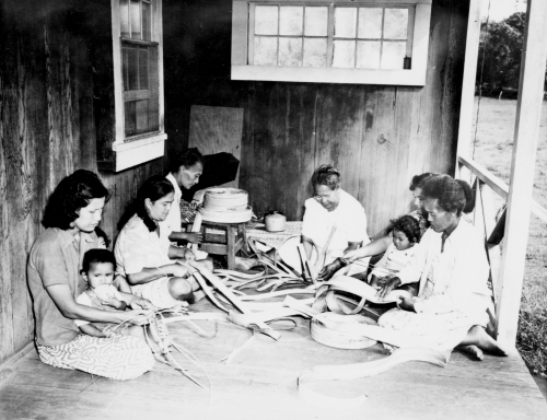 Lauhala weavers sponsored by the University of Hawaii extension service; (Lt. to rt.: Mrs. Helen Kekalia, Mrs. Louisa Laumana, Mrs. Daisy Moore, Aunt Alice Kaulili, Mrs. Louise Caster and Mrs. Ellen Smith); Hoolehua, Molokai, 1949. Call Number: E.C. Hawaiian. Art. Weaving. Image from Bishop Museum Archives, Honolulu, Hawaii. Images are not to be re-used without permission.