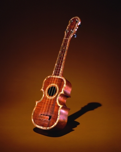 ‘Ukulele made in the 1930's by David Mahelona of koa, mother-of-pearl, brass, plastic, metal, wood, and cat gut. Photograph by Seth Joel. From: Roger Rose, Hawai‘i: The Royal Isles (Honolulu: Bishop Museum Press, 1980), pg.17, no. 164. Call Number: Hawaii: The Royal Isles Accession Number: 1976.129 Location: Bishop Museum Image from Bishop Museum Archives, Honolulu, Hawaii. Images are not to be re-used without permission.