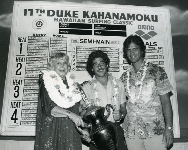 Nadine Kahanamoku, Michael Ho and Henry Ayau at the 17th Duke Kahanamoku Surfing Classic, 1981. Collection: Kahanamoku Collection Call Number: Kahanamoku. Recreation. Sports. Surfing. Location: Bishop Museum Archives Image from Bishop Museum Archives, Honolulu, Hawaii. Images are not to be re-used without permission.