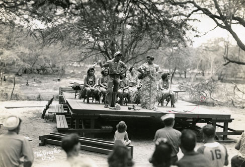 The interactions between the military and civilian residents of Hawaiʻi varied a great deal. Entertainers like this hula troupe were always welcomed by men who missed the sight of women, and many local people were hospitable and friendly to men who were far from home. At other times, however, friction developed. Cultural misunderstandings sometimes led to attitude problems, anger, and fights. Call Number: Military. War. WWII. Entertainment. Artifact Number: SP_86706 Location: Bishop Museum Archives Image from Bishop Museum Archives, Honolulu, Hawaii. Images are not to be re-used without permission.