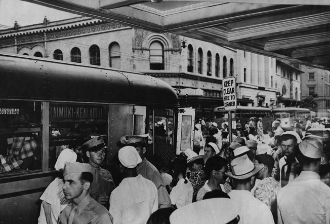 Downtown Honolulu was crowded with uniformed personnel towards the end of World War II, and in small towns throughout the islands the military often outnumbered the civilians. Everyone felt the strain; residents were sometimes resentful of being ordered around, while the soldiers and sailors complained of few opportunities for recreation and of being overcharged for what little they could get. Collection: General Photograph Collection Call Number: 1991.196, folder 4 Artifact Number: CP 126177 Accession Number: 1991.196 Location: Bishop Museum Archives Image from Bishop Museum Archives, Honolulu, Hawaii. Images are not to be re-used without permission.