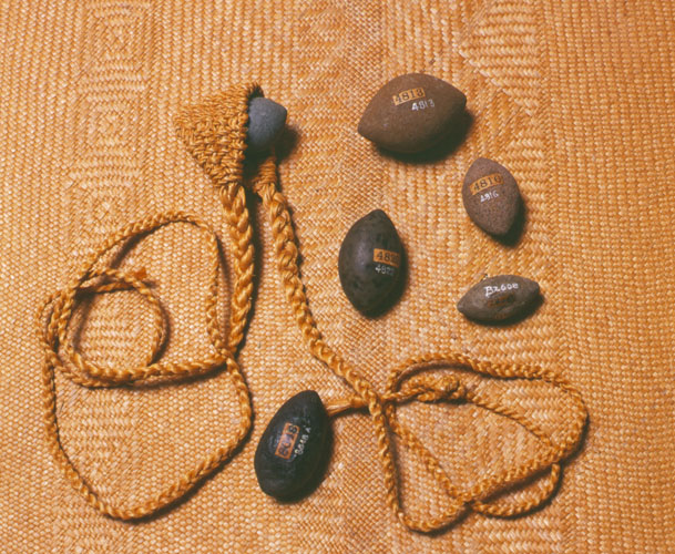 Ma‘a with sling stones of various sizes from Lua: Art of the Hawaiian Warrior by Richard Paglinawan, Mitchell Eli, Moses Kalauokalani, and Jerry Walker. Honolulu, Hawaii: Bishop Museum, 2006. Photo by David Franzen. Ma‘a and stone by R. Nakama. Call Number: GV1100.H3 P34 2006, page 51. Image from Bishop Museum Archives, Honolulu, Hawaii. Images are not to be re-used without permission.